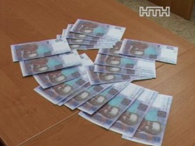 В Сумах девушка отдала долг фальшивыми банкнотами